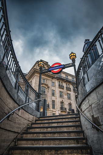 The picture shows the staircase of the tube station at Piccadilly Circus in rainy weather.