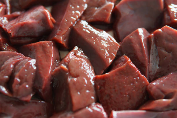 Sliced ​​raw liver Sliced ​​raw liver. Liver is incredibly rich in nutrients and vitamins animal liver stock pictures, royalty-free photos & images