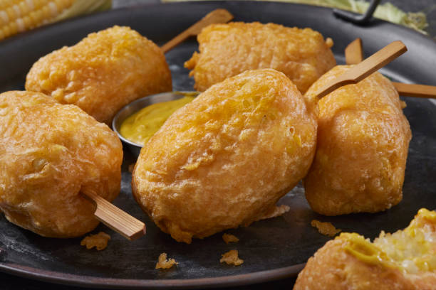 Beer Battered Corn on the Corn Beer Battered Corn on the Corn with Spicy Mustard Dip corn cob eaten stock pictures, royalty-free photos & images