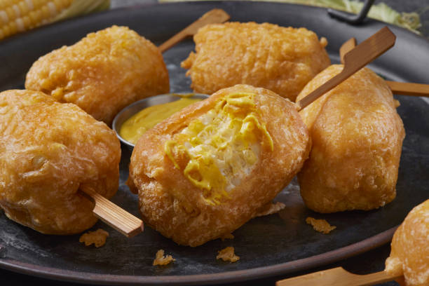 Beer Battered Corn on the Corn Beer Battered Corn on the Corn with Spicy Mustard Dip corn cob eaten stock pictures, royalty-free photos & images