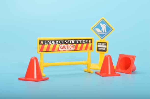 istock Traffic road barrier: A warning barrier for road closure and website under construction page. Includes warning and stop signs, roadwork, traffic barricades, cones, and safety barricades. 1476741470