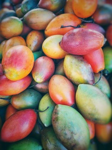 tree tomatoes sold at open-air stalls.  They are little known.