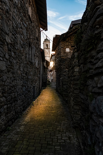 Old street in an Italian village of Lake Como with sunset colors