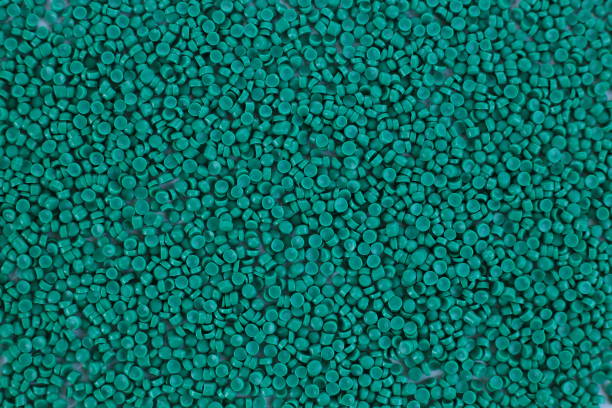 istock Close-up of green plastic polymer granules. polymer plastic. compound polymer. PVC resin compounds. Tinted plastic granulate for injection moulding process. 1476751753