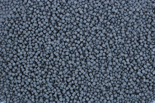 istock Close-up of grey plastic polymer granules. polymer plastic. compound polymer. PVC resin compounds. Tinted plastic granulate for injection moulding process. 1476751874