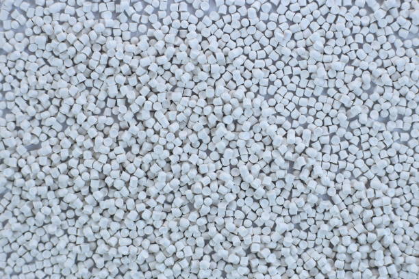 istock Close-up of white plastic polymer granules. polymer plastic. compound polymer. PVC resin compounds. Tinted plastic granulate for injection moulding process. 1476751910