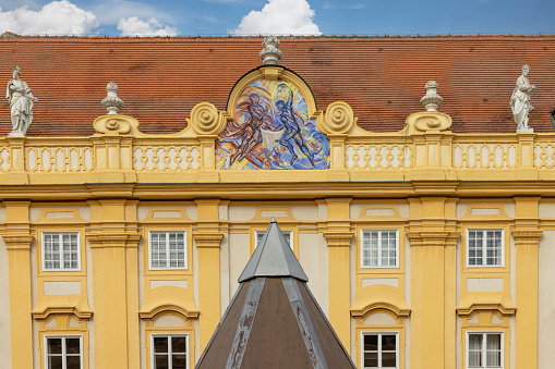 Melk, Austria - February 24, 2023: Melk Abbey on hill above town, facade of building on Prelate's courtyard. It was was founded in 11th century, today's baroque abbey was built in 18th century