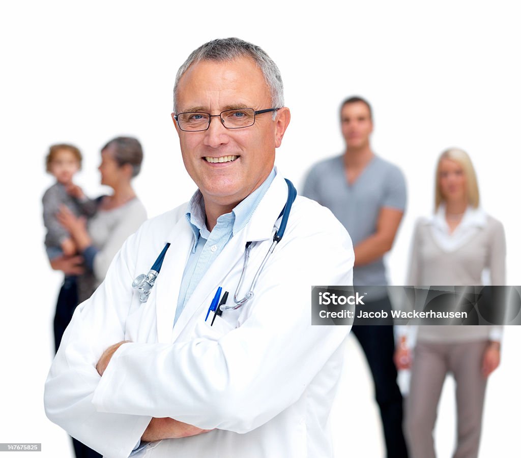 Happy senior doctor with family standing in background 60-64 Years Stock Photo