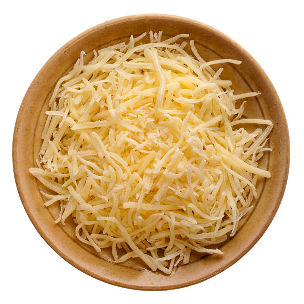 postrzępiony łagodne ser cheddar - food and drink grated food dairy product zdjęcia i obrazy z banku zdjęć