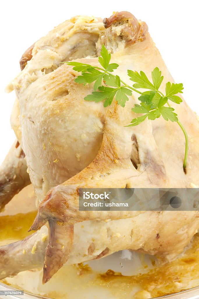 Pollo a la parrilla con perejil, aislado - Foto de stock de Pollo relleno libre de derechos