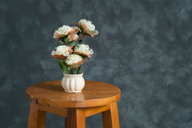 istock Beautiful flower in pot on Wooden stool 1476761644