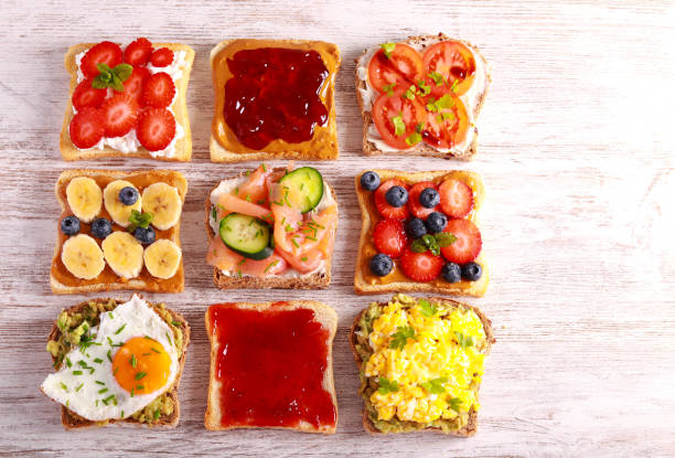 istock Selection of breakfast toasts with different toppings - savory and sweet. 1476761754