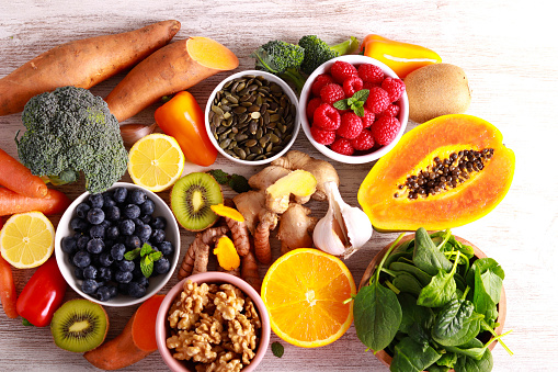 Immune boosting food. Assortment of healthy vegetables, fruits, berries and seeds.