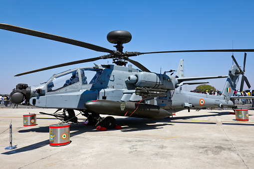 Bangalore KA India - February 16, 2023 - Taken this picture at Aero India in Bangalore India of AH-64 Apache on static display in front of general public. The helicopter is on display with full armament. This is open to public and public has full access for photography, videography and even taking joy ride.
