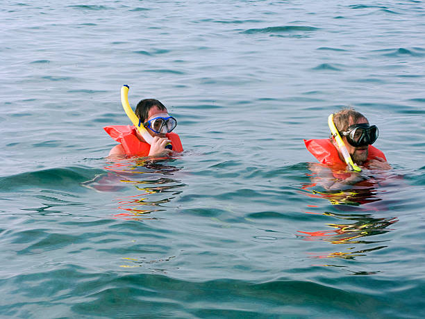istock Two men in the life vests and masks 147676716