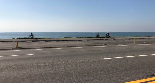 Bicyclists by the ocean in Malibu