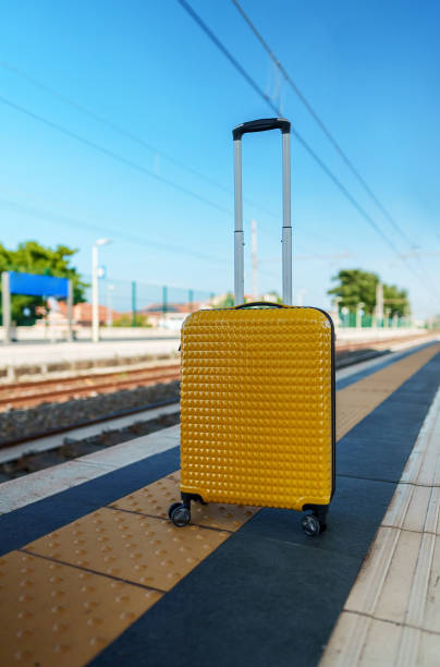 istock Forgotten travel bag on the train station. 1476783797