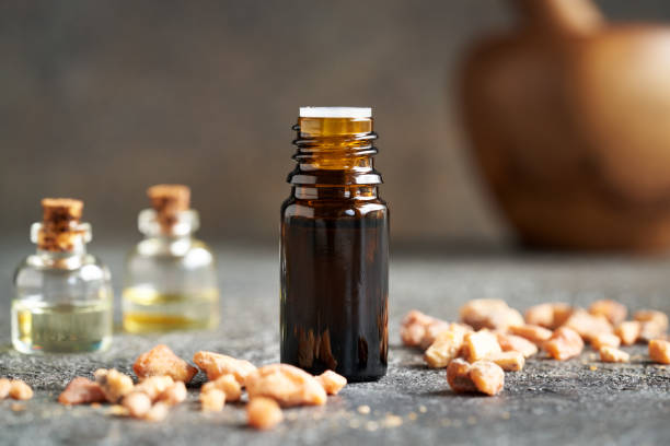 A dropper bottle of essential oil with styrax resin stock photo
