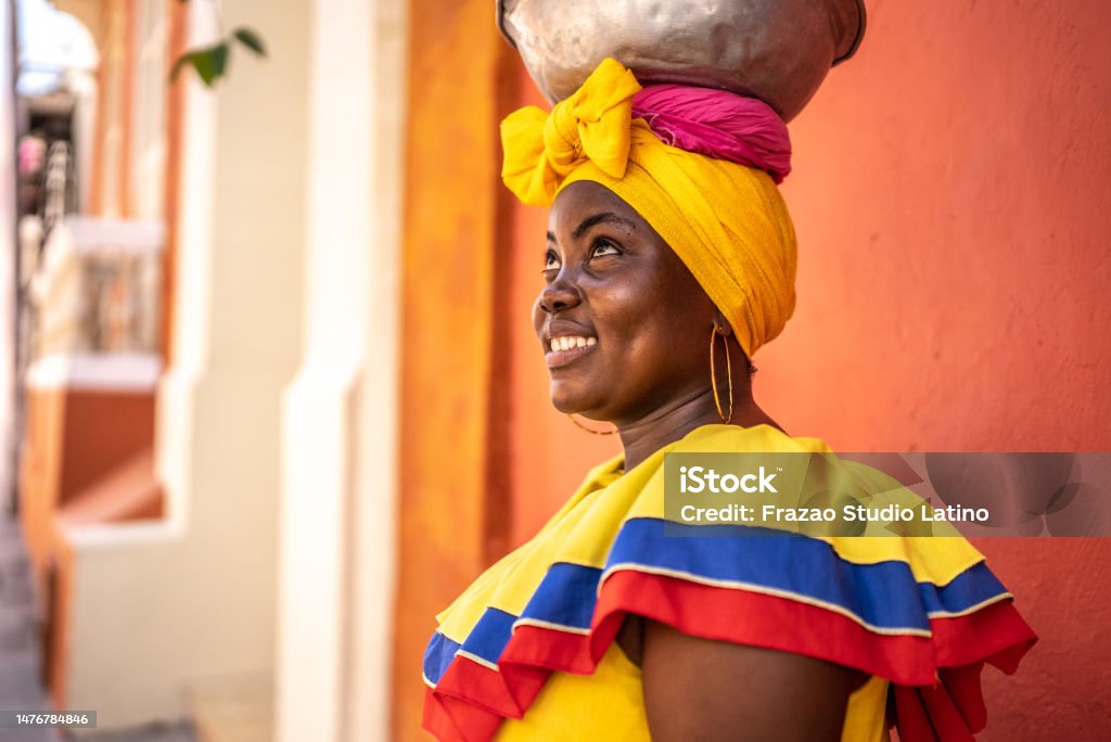 Mid adult palenquera looking away contemplating in Cartagena, Colombia 30-34 Years Stock Photo