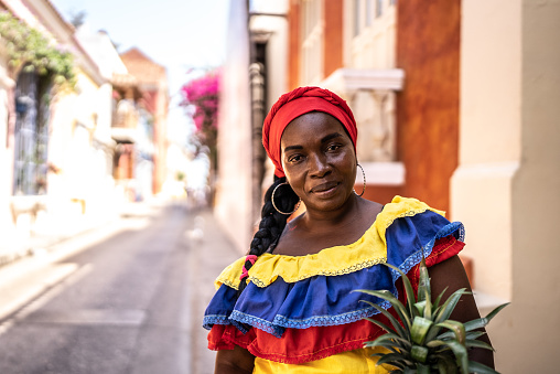 Portrait of mature palenquera selling fruit on the street in Cartagena
