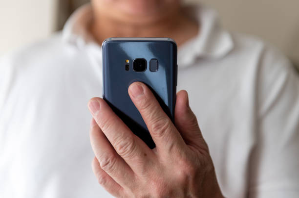 istock A person holding a smartphone. Technology use concept. 1476785261