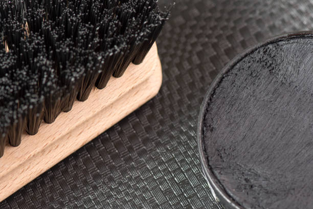 istock Black shoe shine wax and boot brush. Protecting and impregnate leather shoes. 1476787139