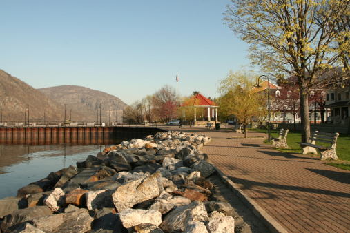 Early morning view of water front park with band stand, and view of Storm King Mountain in the background.