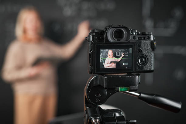 istock Woman recording lesson on professional camera 1476799229