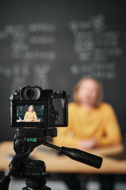 istock Teacher recording lesson on professional camera 1476799239