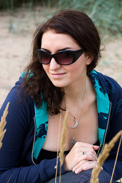 Young brunette in sunglasses stock photo