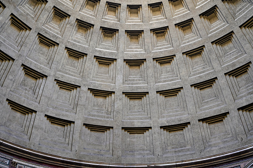 An impressive wide view of the majestic Pantheon, in the heart of Ancient Rome. Built in 27 BC by the Consul Marco Vispanio Agrippa for the Emperor Augustus and dedicated to all the Roman divinities, the majestic Pantheon is one of the best preserved Roman structures in the Eternal City and in the world. In addition, the Pantheon is also a Catholic church consecrated in 609 AD by Pope Bonficio IV and called the Basilica of Santa Maria ad Martyres. Within its perimeter some members of the Italian royal family and famous artists are buried, including the painter Raphael, a great protagonist of Renaissance art. The dome of the Pantheon, built in concrete and brick, is a masterpiece of engineering and the prototype of all the domes subsequently built in Christian churches in Europe. With a diameter of 43.44 meters, it is still the largest dome in the world today. In 1980 the historic center of Rome was declared a World Heritage Site by Unesco. Super wide angle image in HDR format.