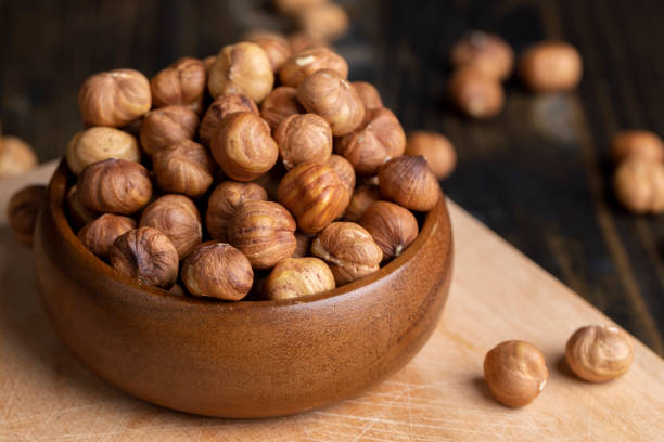 istock Peeled hazelnuts during cooking, close-up of freshly picked hazelnuts in the kitchen 1476803736