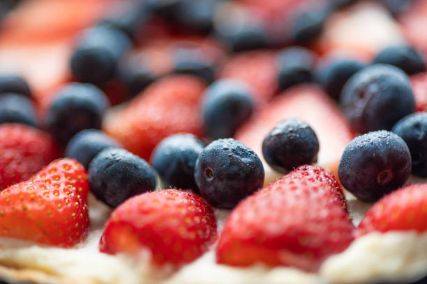 Tasty homemade cake with blueberries and raspberry