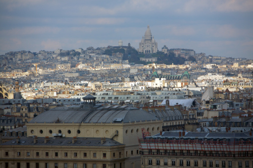 This is a picture of Paris taken from atop one of the towers of Notre Dame.  Sacre Couer cathedral in Montmarte is in the distance.