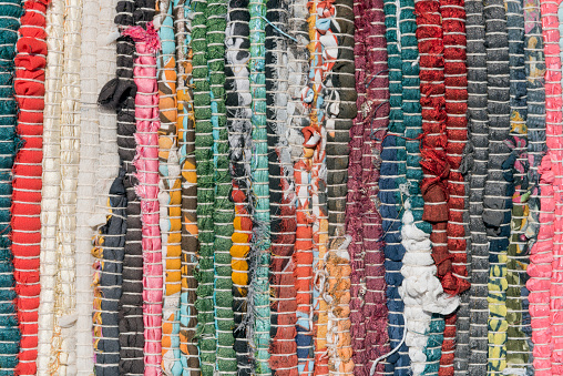 Vibrant colors of a traditional Andes textile on the local art and craft market of Otavalo, Ecuador. Textiles are found in the Andes countries of Bolivia, Ecuador and Peru.