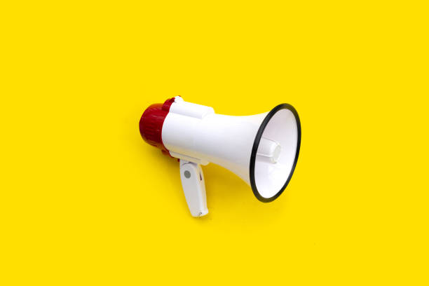 istock Red and white megaphone on yellow background. 1476816991