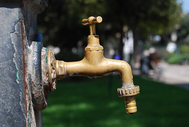 Water tap in a park stock photo