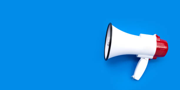 istock Red and white megaphone on blue background. 1476817566