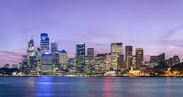 Sydney skyline at dusk with deep pink sky stock photo