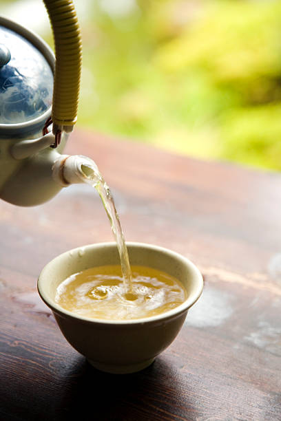 istock Pouring Green Tea from Pot 147681840