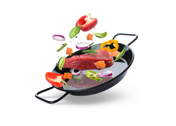 istock Tasty fresh ingredients and pan on white background 1476820038