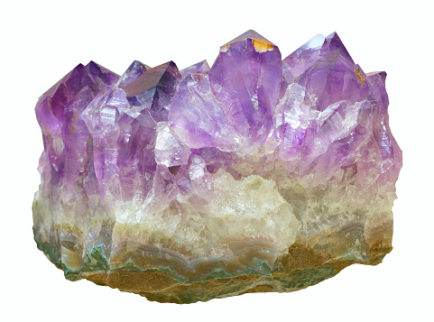 Purple mineral crystal on white background
