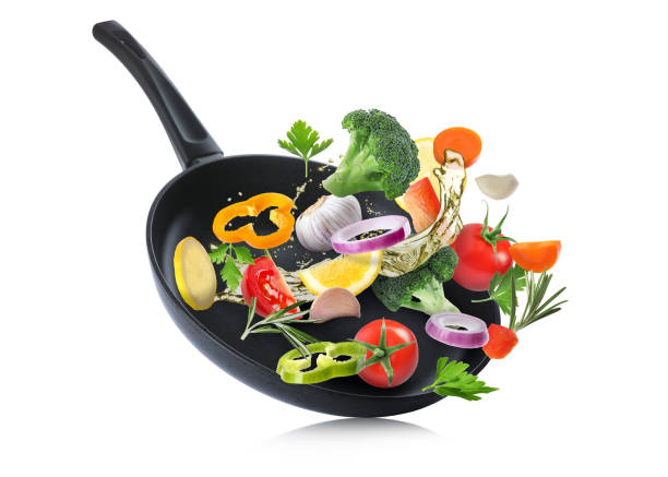 istock Tasty fresh ingredients and frying pan on white background 1476820580