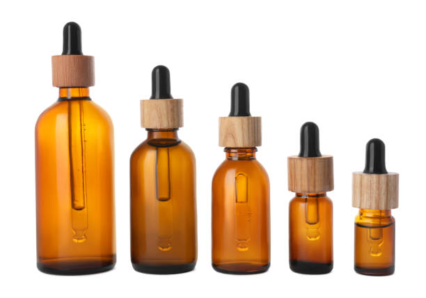 istock Row with different bottles of essential oil on white background 1476823356