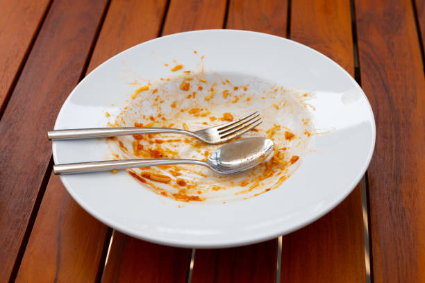 istock Dirty dish on wooden background. 1476824308