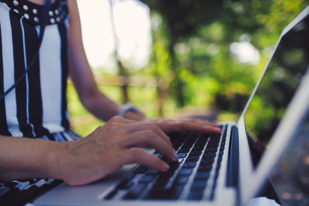 istock Close-up photo of a person's hand using a laptop 1476827253