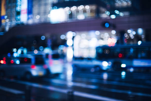 istock Blurring of cars driving at night 1476827587