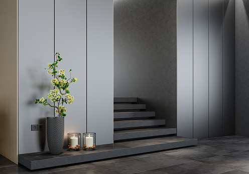 Modern and minimalist apartment interior design. Entrance with dark stone stairs. 3d renderings.