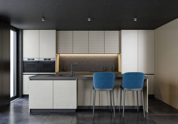 istock Modern minimalist kitchen with long island with stools. Gold panels and dark stone. 1476833733