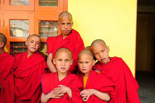 istock Little Tibetan monks standing in front of their classroom 147683662